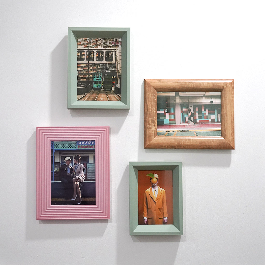 Assorted quirky eclectic 4r and 5r photo frames with fun picture on wall and can be placed on table