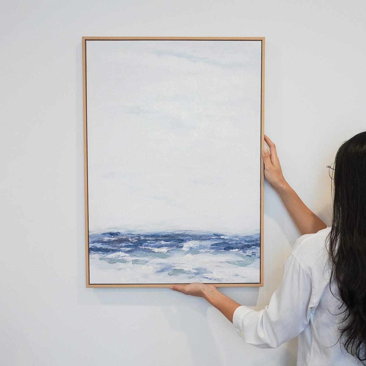 woman hanging Abstract textured wall art affordable oil painting white and blue sea portrait