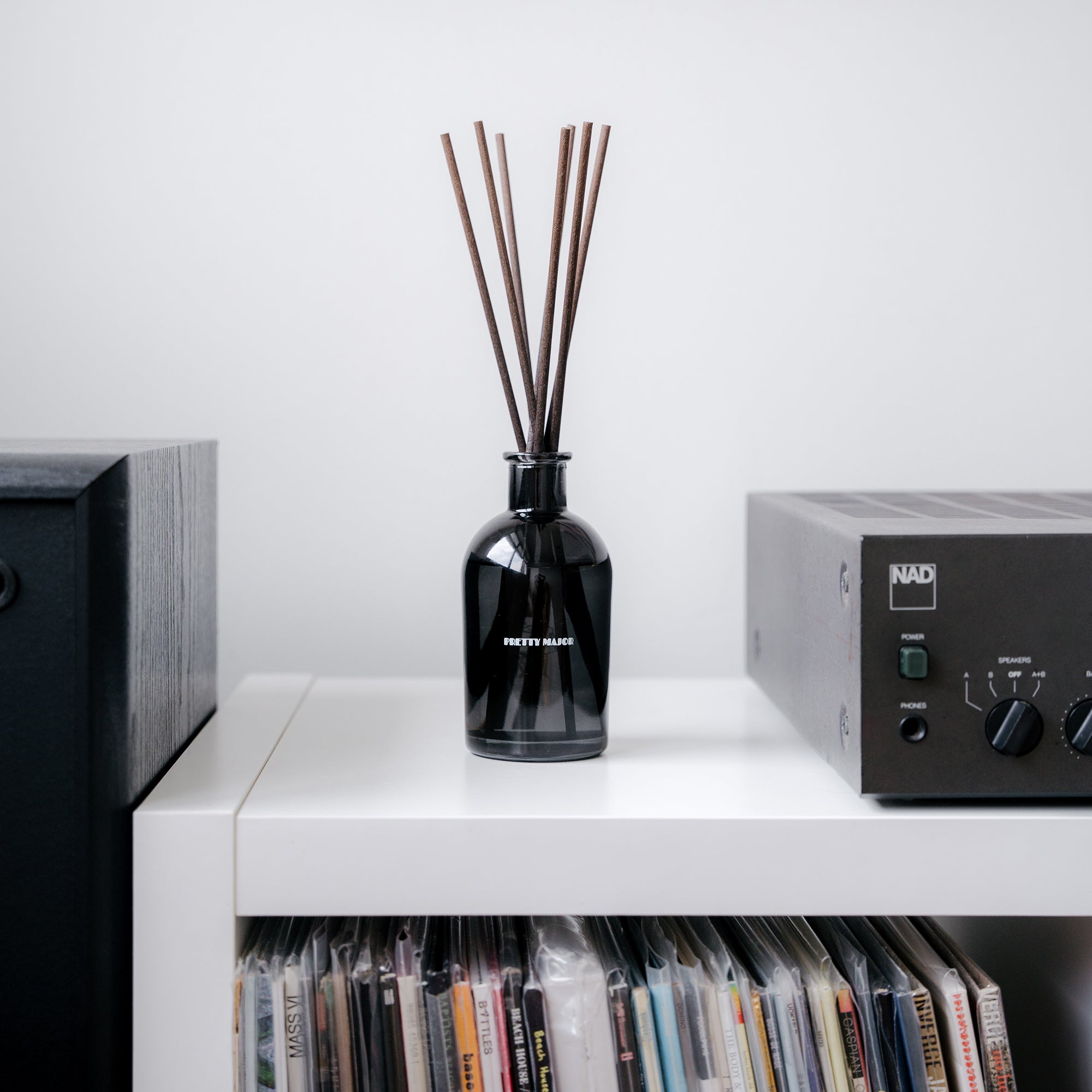 reed diffuser on music room vinyl shelf
